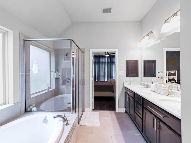 4006 Trento Ct, Katy, TX 77493 - ensuite bathroom featuring double vanity, a garden tub, a shower stall, tile patterned floors, and a ceiling fan