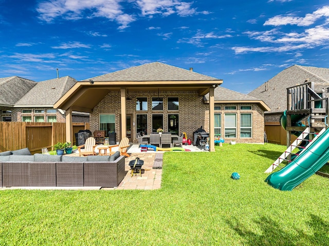 4006 Trento Ct, Katy, TX 77493 - rear view of house featuring an outdoor hangout area, a playground, brick siding, and a patio