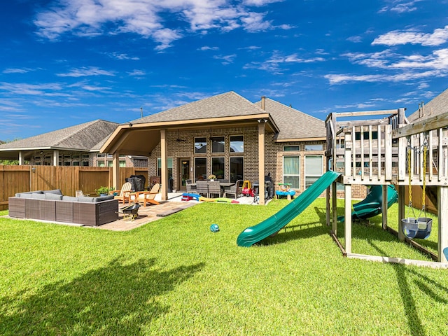 4006 Trento Ct, Katy, TX 77493 - back of property with an outdoor hangout area, a playground, a fenced backyard, a patio, and roof with shingles