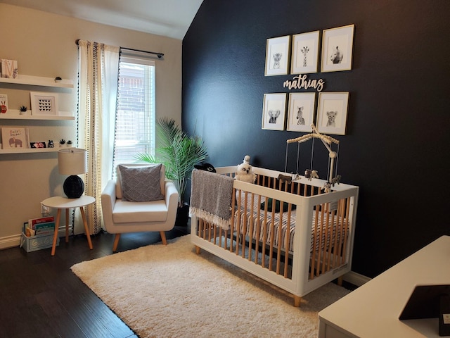 4006 Trento Ct, Katy, TX 77493 - bedroom featuring a crib, wood finished floors, and vaulted ceiling
