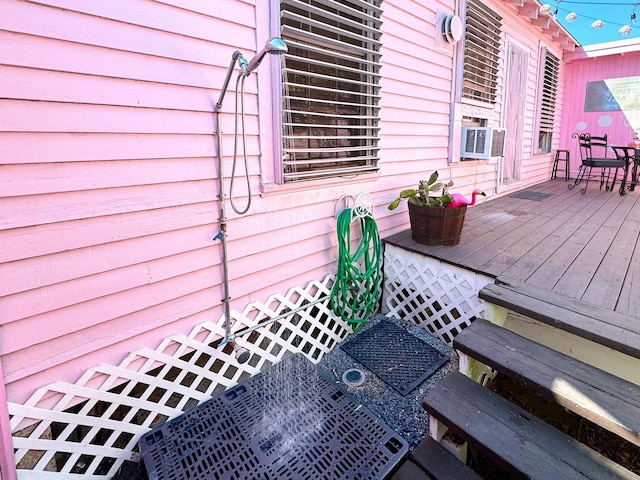 1309 55th St, Galveston, TX 77551 - deck featuring cooling unit and outdoor dining space