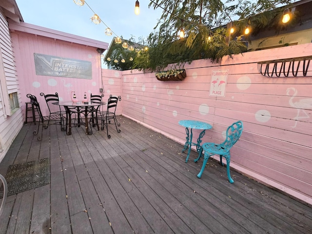 1309 55th St, Galveston, TX 77551 - wooden terrace featuring outdoor dining space