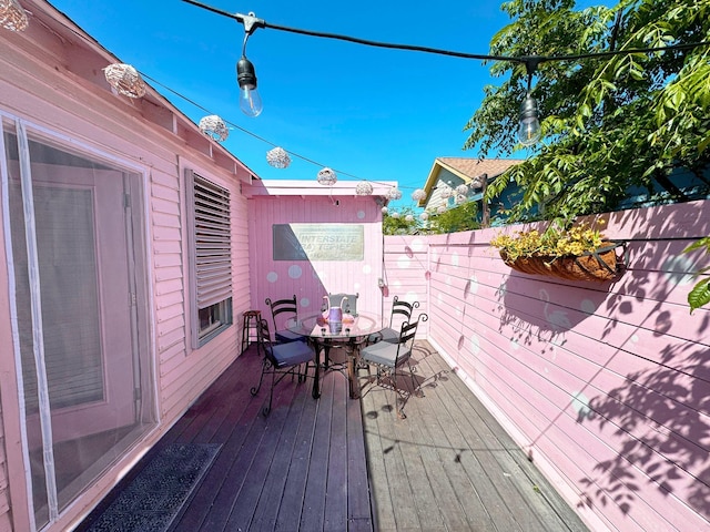 1309 55th St, Galveston, TX 77551 - wooden deck featuring outdoor dining area