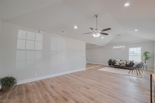3514 Fuqua St, Houston, TX 77047 - living room with lofted ceiling, a ceiling fan, light wood-type flooring, recessed lighting, and a chandelier