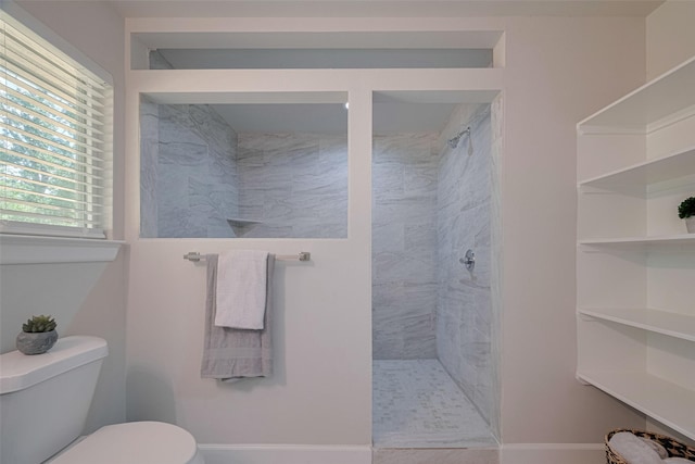 3514 Fuqua St, Houston, TX 77047 - bathroom featuring a tile shower and toilet