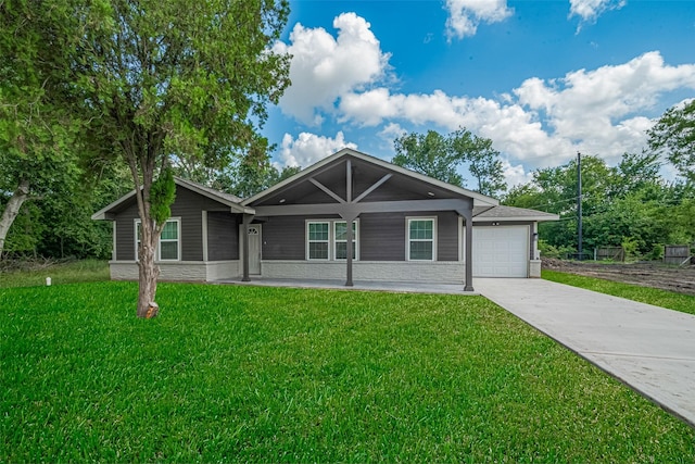 3514 Fuqua St, Houston, TX 77047 - single story home featuring an attached garage, driveway, a front yard, and covered porch