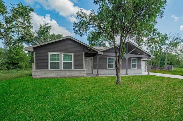 3514 Fuqua St, Houston, TX 77047 - view of front of house featuring a front lawn and stone siding