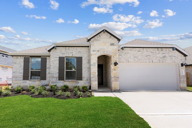 6226 Pelican Ridge Way, League City, TX 77573 - french country inspired facade featuring a front yard, a garage, roof with shingles, driveway, and stone siding