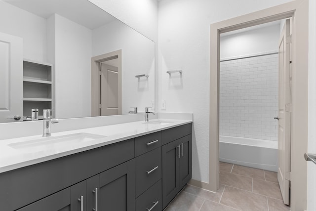 6226 Pelican Ridge Way, League City, TX 77573 - bathroom featuring double vanity, tile patterned flooring, and washtub / shower combination