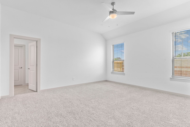 6226 Pelican Ridge Way, League City, TX 77573 - spare room featuring light colored carpet, vaulted ceiling, and ceiling fan