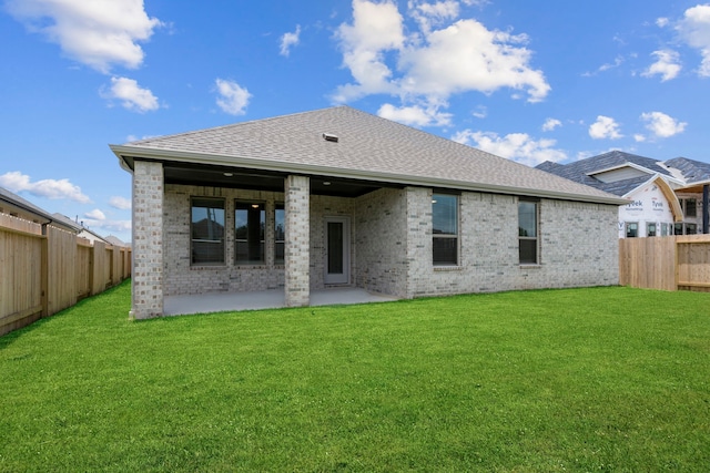 6226 Pelican Ridge Way, League City, TX 77573 - back of house featuring brick siding, a fenced backyard, a patio area, and a shingled roof