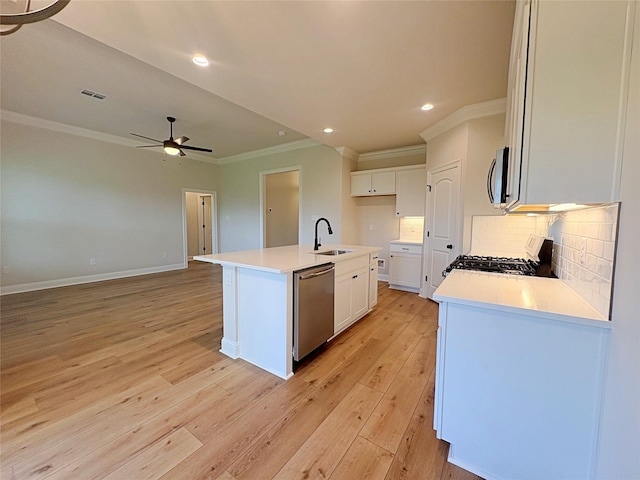 6715 Arbor Way, Orange, TX 77630 - kitchen with appliances with stainless steel finishes, ornamental molding, ceiling fan, decorative backsplash, and open floor plan