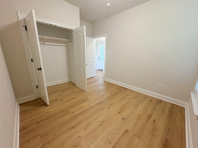 6715 Arbor Way, Orange, TX 77630 - unfurnished bedroom with light wood-style floors and a closet