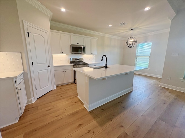 6715 Arbor Way, Orange, TX 77630 - kitchen with stainless steel appliances, crown molding, decorative backsplash, white cabinets, and light wood-type flooring