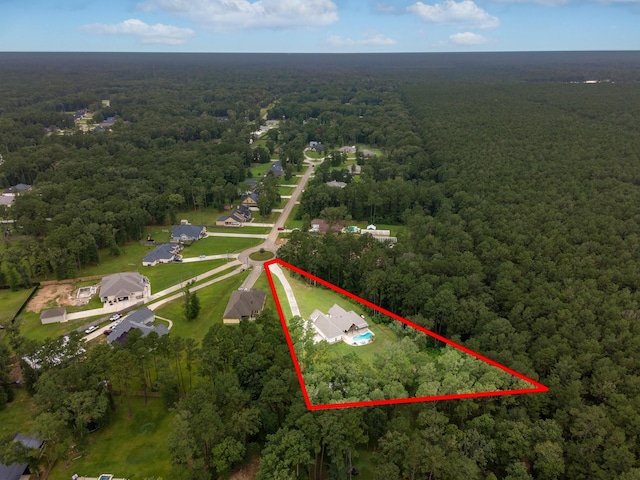 27647 N Salado Ct, Splendora, TX 77372 - view of property location featuring a forest and property parcel outlined