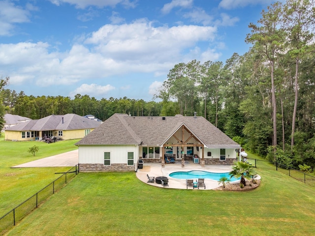 27647 N Salado Ct, Splendora, TX 77372 - rear view of house featuring stone siding, a patio, a fenced backyard, and outdoor lounge area