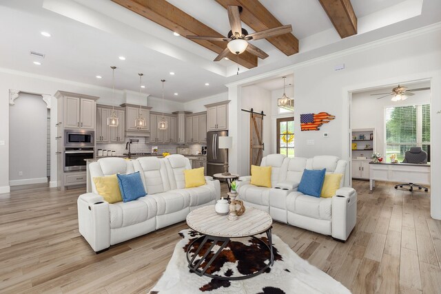 27647 N Salado Ct, Splendora, TX 77372 - living area featuring ceiling fan, plenty of natural light, a barn door, light wood finished floors, and recessed lighting