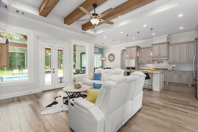 27647 N Salado Ct, Splendora, TX 77372 - living area featuring a ceiling fan, light wood-style floors, beam ceiling, crown molding, and french doors