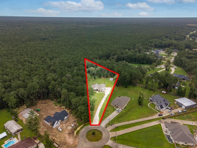 27647 N Salado Ct, Splendora, TX 77372 - aerial view of residential area with a heavily wooded area and property parcel outlined