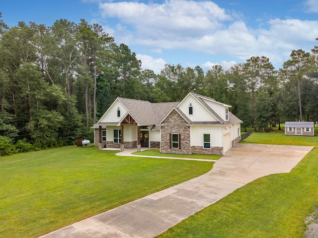 27647 N Salado Ct, Splendora, TX 77372 - view of front of home featuring stone siding, a porch, concrete driveway, a front lawn, and a garage