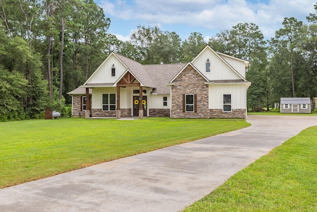 27647 N Salado Ct, Splendora, TX 77372 - modern inspired farmhouse featuring stone siding, driveway, a front lawn, and board and batten siding