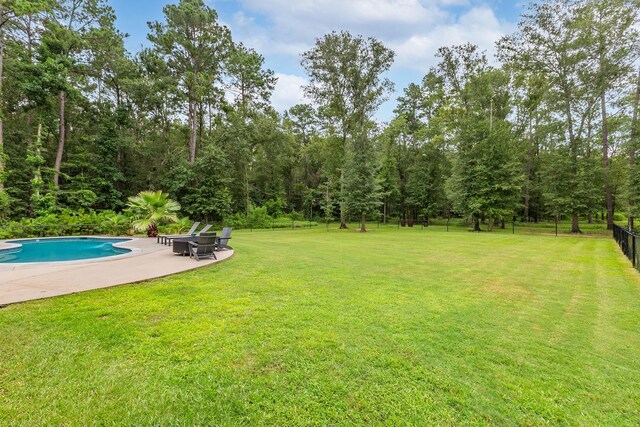 27647 N Salado Ct, Splendora, TX 77372 - view of yard with a patio area and an outdoor pool