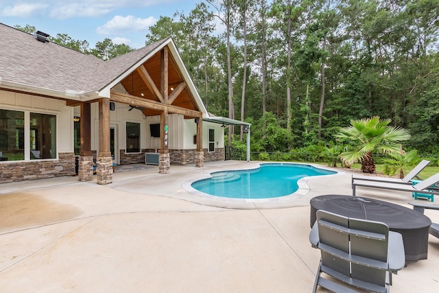27647 N Salado Ct, Splendora, TX 77372 - outdoor pool featuring a ceiling fan and a patio