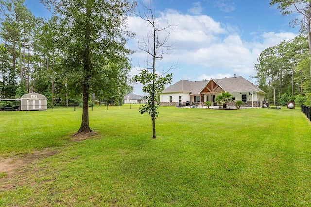 27647 N Salado Ct, Splendora, TX 77372 - view of yard with a storage unit