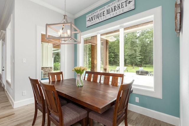 27647 N Salado Ct, Splendora, TX 77372 - dining space featuring a chandelier, light wood finished floors, and crown molding