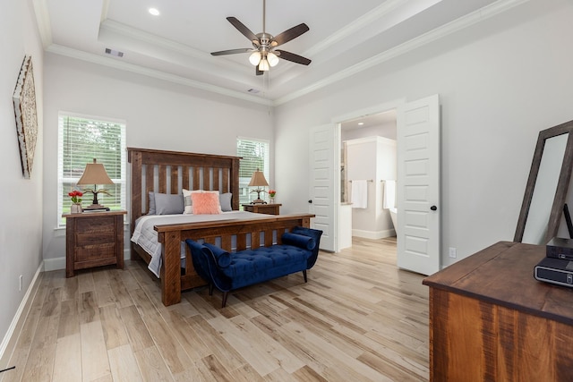 27647 N Salado Ct, Splendora, TX 77372 - bedroom featuring a tray ceiling, light wood-style floors, multiple windows, crown molding, and ensuite bathroom