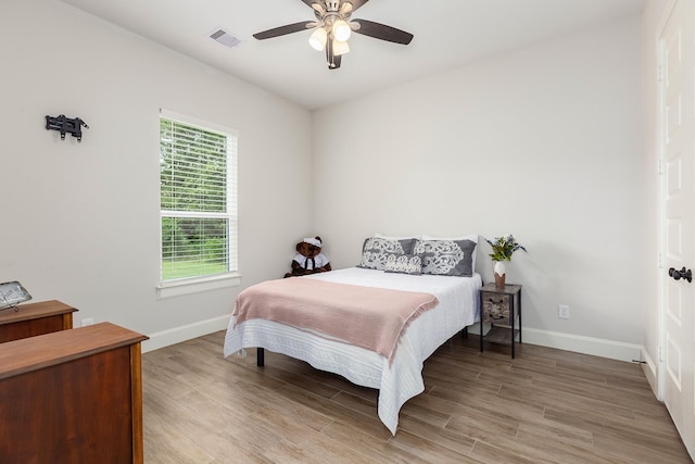 27647 N Salado Ct, Splendora, TX 77372 - bedroom featuring light wood-style flooring and a ceiling fan