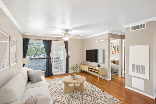 101 Stratford St Unit 103, Houston, TX 77006 - living room with wood finished floors, ornamental molding, and ceiling fan
