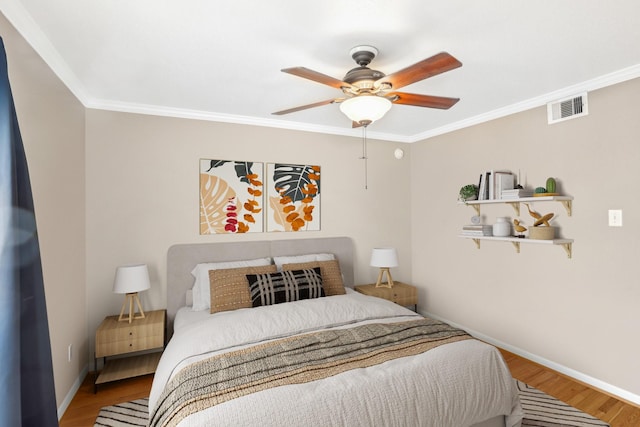 101 Stratford St Unit 103, Houston, TX 77006 - bedroom with crown molding, wood finished floors, and a ceiling fan