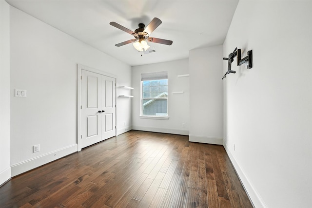938 W 24th St, Houston, TX 77008 - unfurnished bedroom featuring dark wood-style floors and a ceiling fan