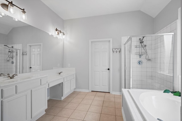 5814 Ashley Spring Ct, Katy, TX 77494 - full bathroom featuring vaulted ceiling, double vanity, a bath, a shower stall, and tile patterned flooring