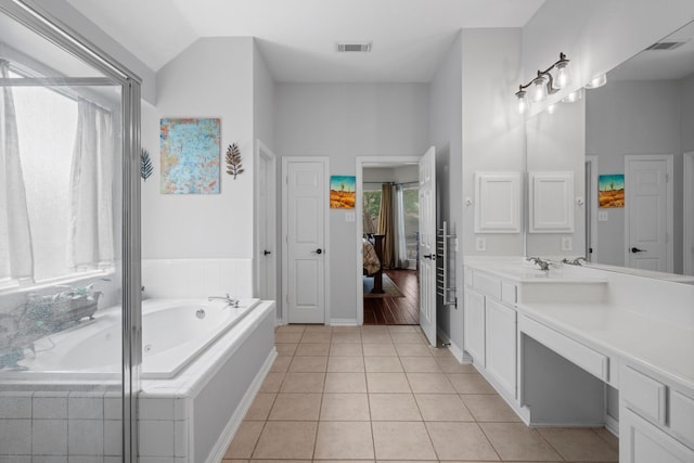 5814 Ashley Spring Ct, Katy, TX 77494 - ensuite bathroom featuring vanity, a bath, and tile patterned flooring
