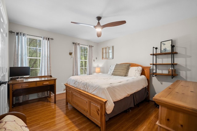 5814 Ashley Spring Ct, Katy, TX 77494 - bedroom featuring wood finished floors, multiple windows, and ceiling fan