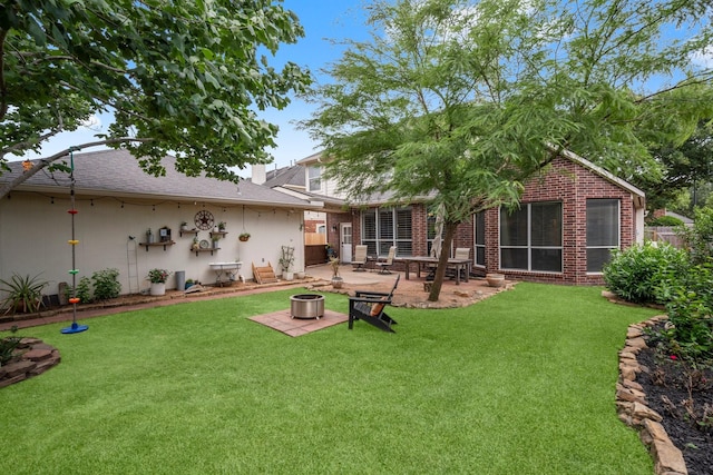 5814 Ashley Spring Ct, Katy, TX 77494 - view of grassy yard with a patio area and an outdoor fire pit