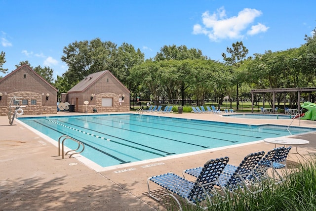 5814 Ashley Spring Ct, Katy, TX 77494 - community pool with a patio area and view of scattered trees