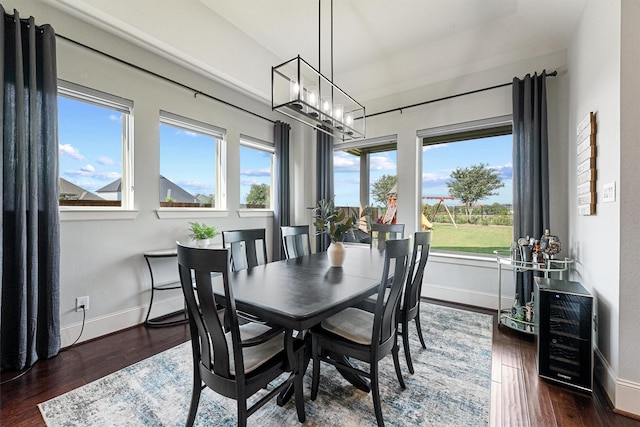 2603 Open Prairie Ln, Katy, TX 77493 - dining space with wood finished floors, a chandelier, and wine cooler