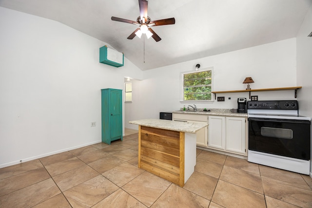 125 James Blvd, Livingston, TX 77351 - kitchen with white electric stove, vaulted ceiling, ceiling fan, white cabinetry, and light tile patterned floors