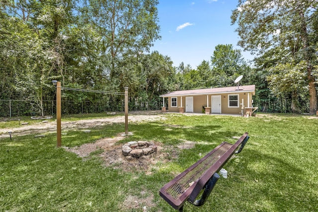 125 James Blvd, Livingston, TX 77351 - view of yard featuring an outdoor fire pit