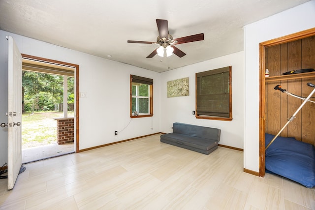 125 James Blvd, Livingston, TX 77351 - unfurnished room featuring plenty of natural light, a ceiling fan, and tile patterned floors