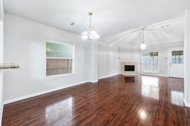 9911 Pierre Ct, Houston, TX 77089 - unfurnished living room featuring a chandelier, hardwood / wood-style floors, a fireplace, and lofted ceiling