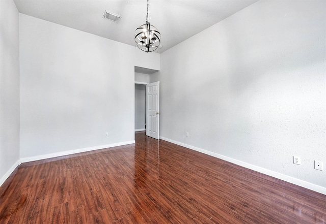 9911 Pierre Ct, Houston, TX 77089 - unfurnished room featuring a chandelier and dark wood-style floors
