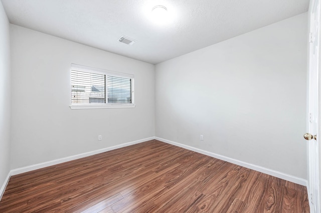 9911 Pierre Ct, Houston, TX 77089 - unfurnished room featuring dark wood-style flooring and baseboards