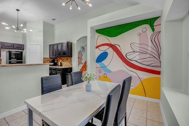 8222 Viny Ridge Dr, Houston, TX 77083 - dining room featuring a chandelier and light tile patterned floors