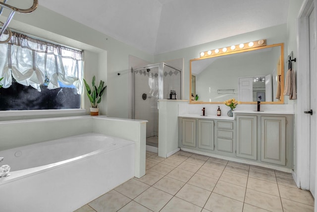 8222 Viny Ridge Dr, Houston, TX 77083 - bathroom featuring a stall shower, a garden tub, tile patterned floors, double vanity, and lofted ceiling