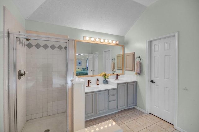 8222 Viny Ridge Dr, Houston, TX 77083 - full bath with double vanity, a shower stall, tile patterned flooring, and lofted ceiling