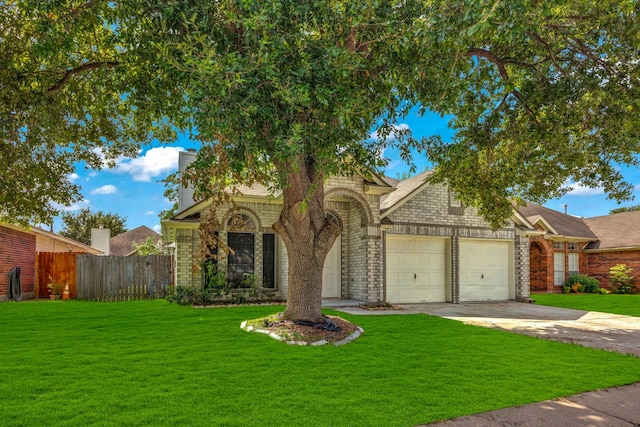 8222 Viny Ridge Dr, Houston, TX 77083 - view of property hidden behind natural elements featuring an attached garage, concrete driveway, brick siding, and a chimney